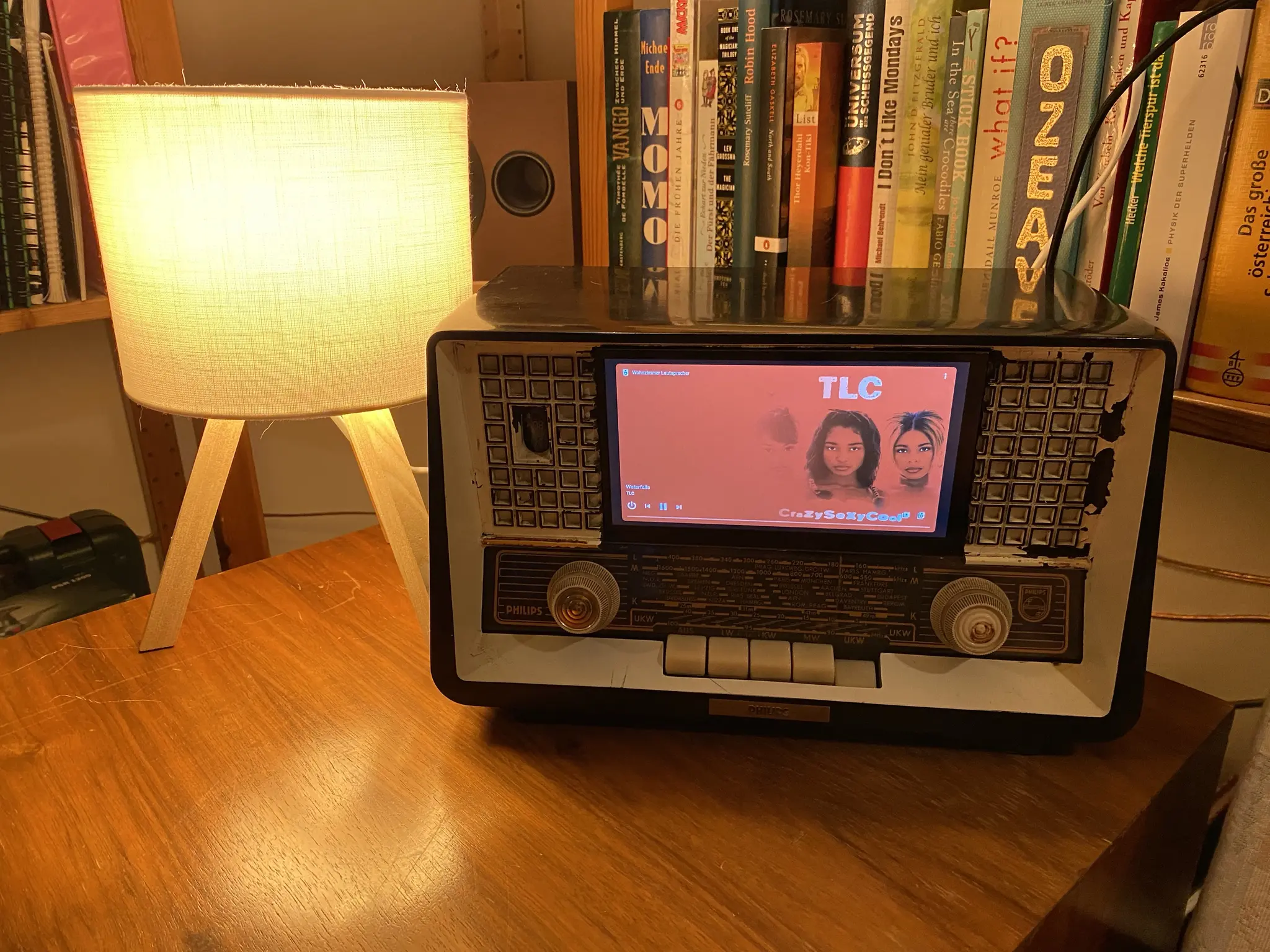 A picture of an old 50s radio, with a touchscreen set into the front