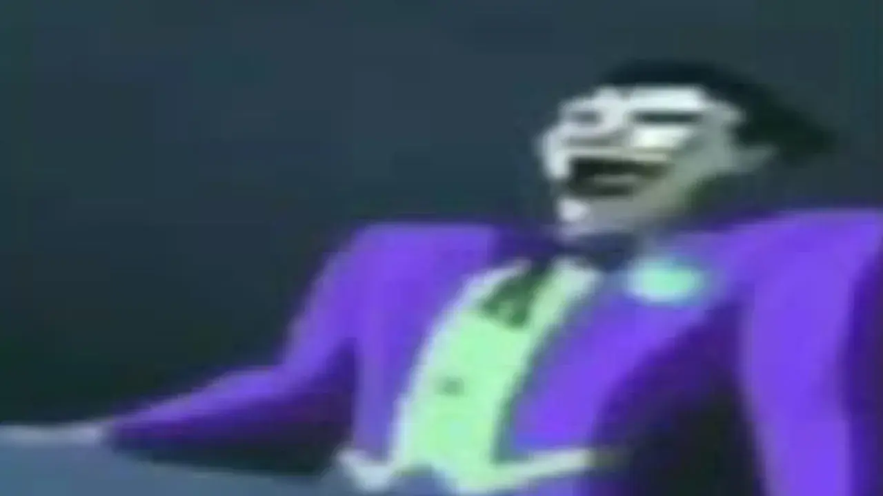 a very low-resolution image of cartoon-Joker (Batman series) laughing